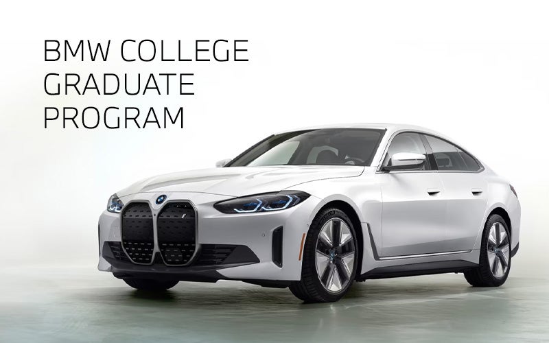 White BMW i4 parked. BMW College Graduate Program. | BMW of Louisville in Louisville KY